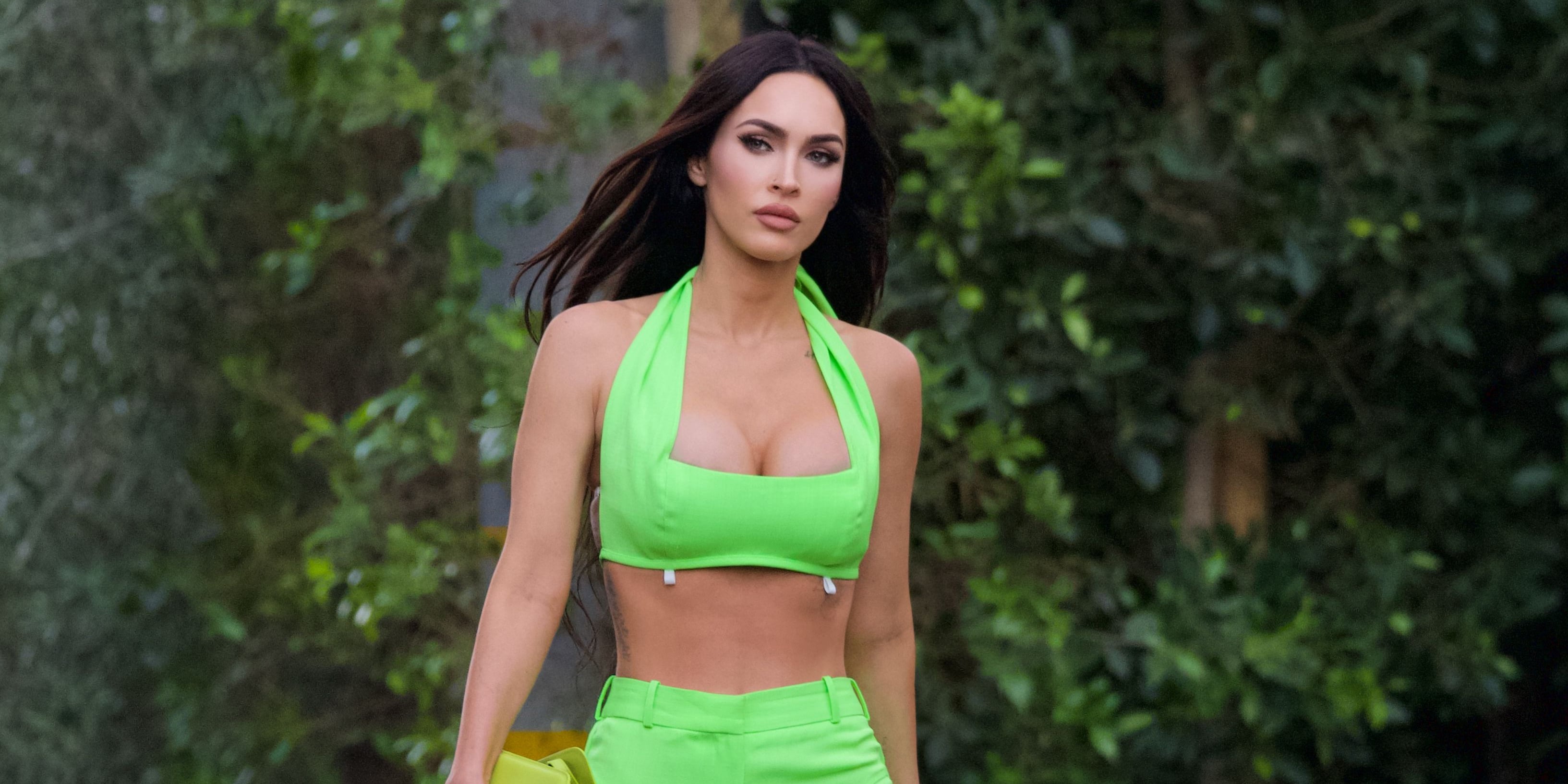Megan Fox flashes taut midriff in sports bra as she and Machine