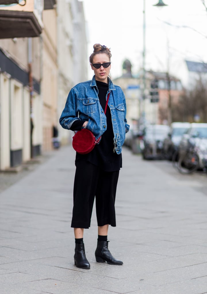 An All-Black Outfit Worn With a Denim Jacket and a Red Bag
