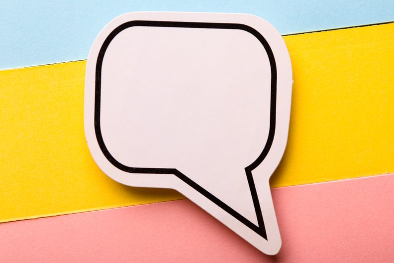 A blank comic book speech bubble on colorful paper.