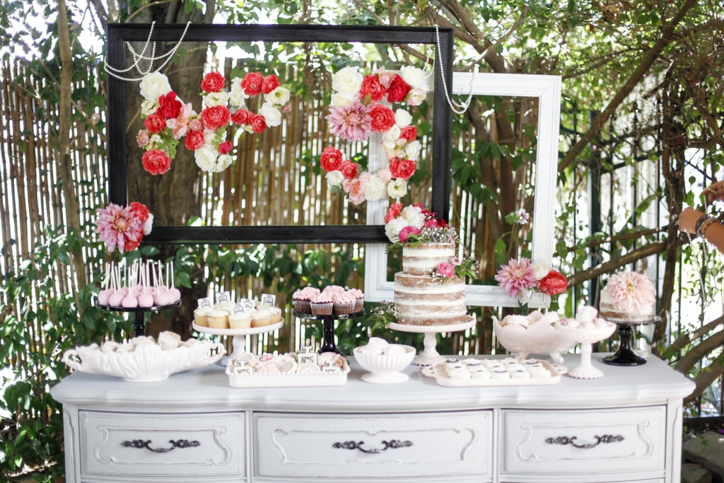 "Because Simone's sophisticated party theme was not your typical kiddie party, I wanted her dessert table to be equally chic. I kept the desserts classic in flavors and filled her table with gorgeous buttercream petal cookies and cupcakes in a variety of pink shades, and miniature cupcake truffle bites. The 'naked' cake topped with fresh flowers made the perfect centerpiece!"
— Jenny Keller