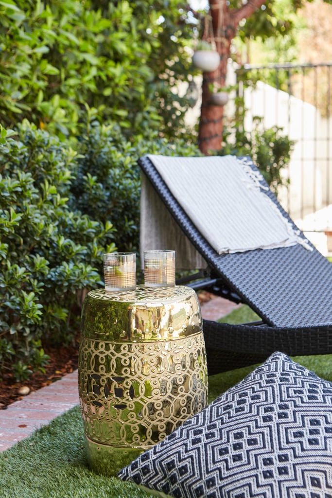 Donna created a cozy sunbathing area complete with Canaan chaise loungers ($408 each), a garden stool side table ($110), and soft throw blankets and pillows.