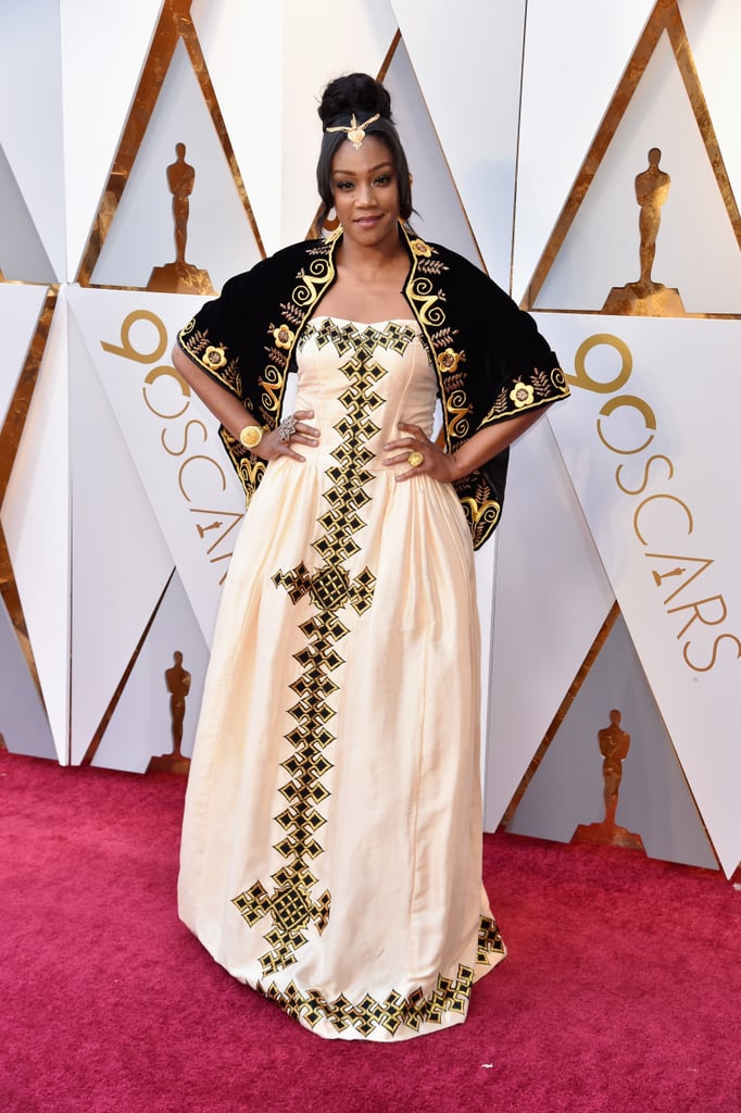 Tiffany Haddish was the belle of the ball at the 2018 Oscars. The Girls Trip actor showed up wearing a regal black, white, and gold dress fit for royalty. The jaw-dropping ensemble was inspired by Tiffany's Eritrean heritage: the zuria is a traditional dress worn by women in the country. 
As Tiffany told Michael Strahan, "My father is from Eritrea and he passed away last year. He said one day I would end up here, and if I ever end up at the Oscars, to honor my people, so I'm honoring my fellow Eritreans."
Although the breakout comedian didn't receive a best supporting actress nomination at the prestigious ceremony as many hoped she would, she's still a winner to us. Read on to see more photos of Tiffany being the queen of our hearts on the red carpet.

    Related:

            
            
                                    
                            

            If You Somehow Aren&apos;t Obsessed With Tiffany Haddish Yet, These Facts Should Do the Trick