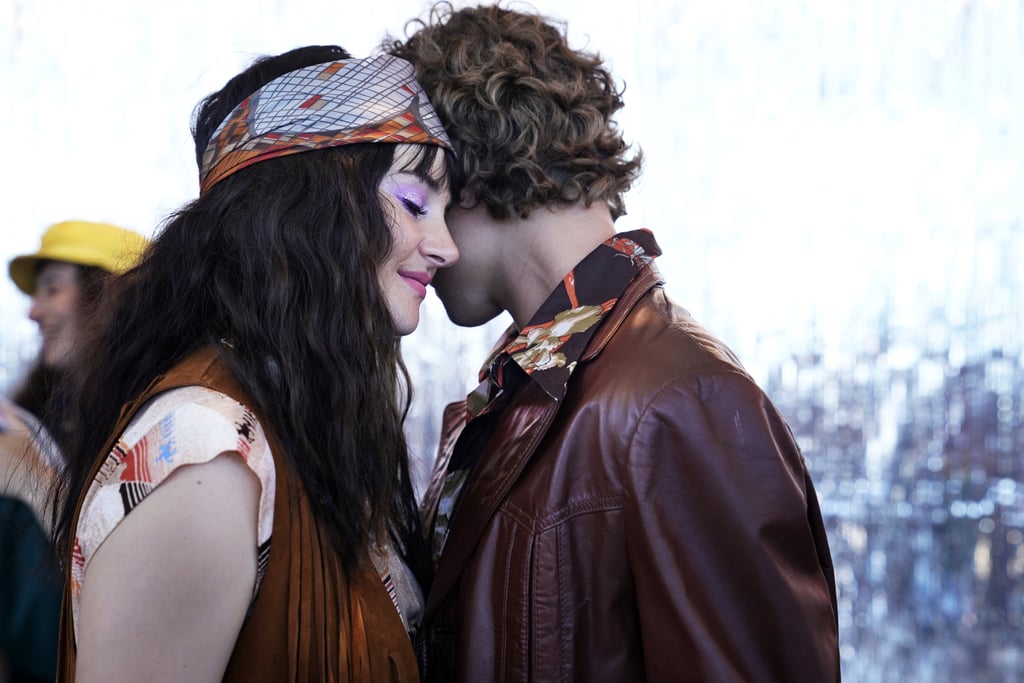 Shailene Woodley as Jane Chapman wearing a fringed vest and printed headband and Douglas Smith as Corey Brockfield wearing a brown leather jacket.