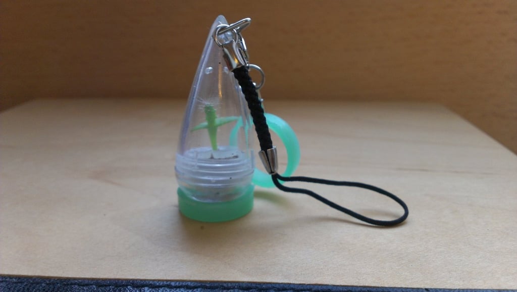 A growing pet bonsai plant phone charm to give you companionship and a chance to practice a tongue twister.