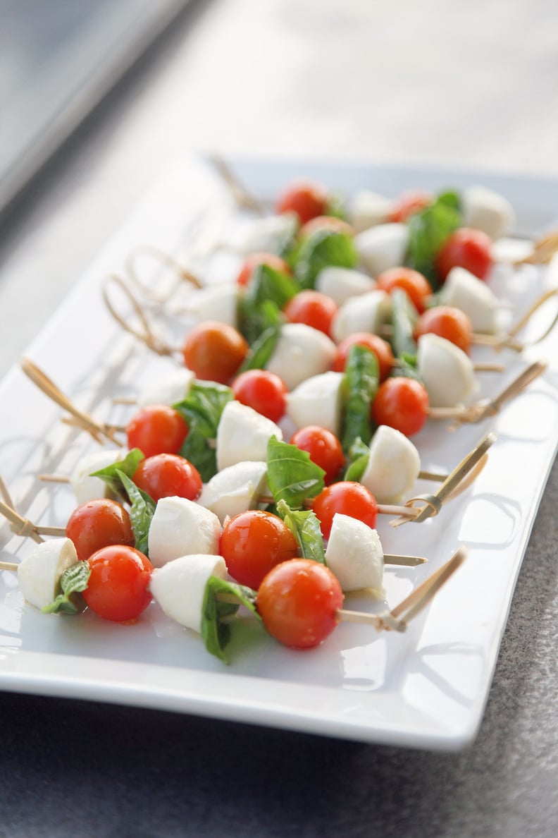 Finally a use for the giant martini glass you thought was such a great  idea! Caprese skewers!