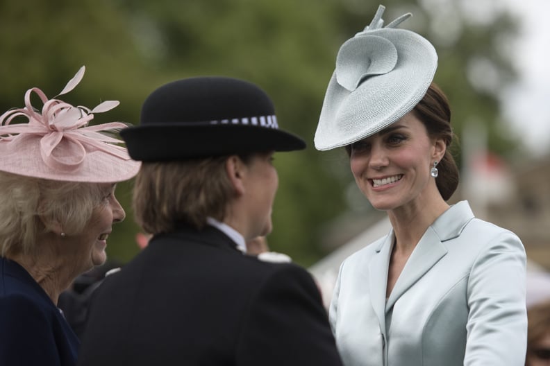 She Wore Matching Colored Topaz Earrings and a Lock & Co Hat