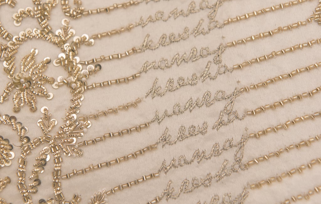 Bride Embroidered Love Story on Wedding Dress