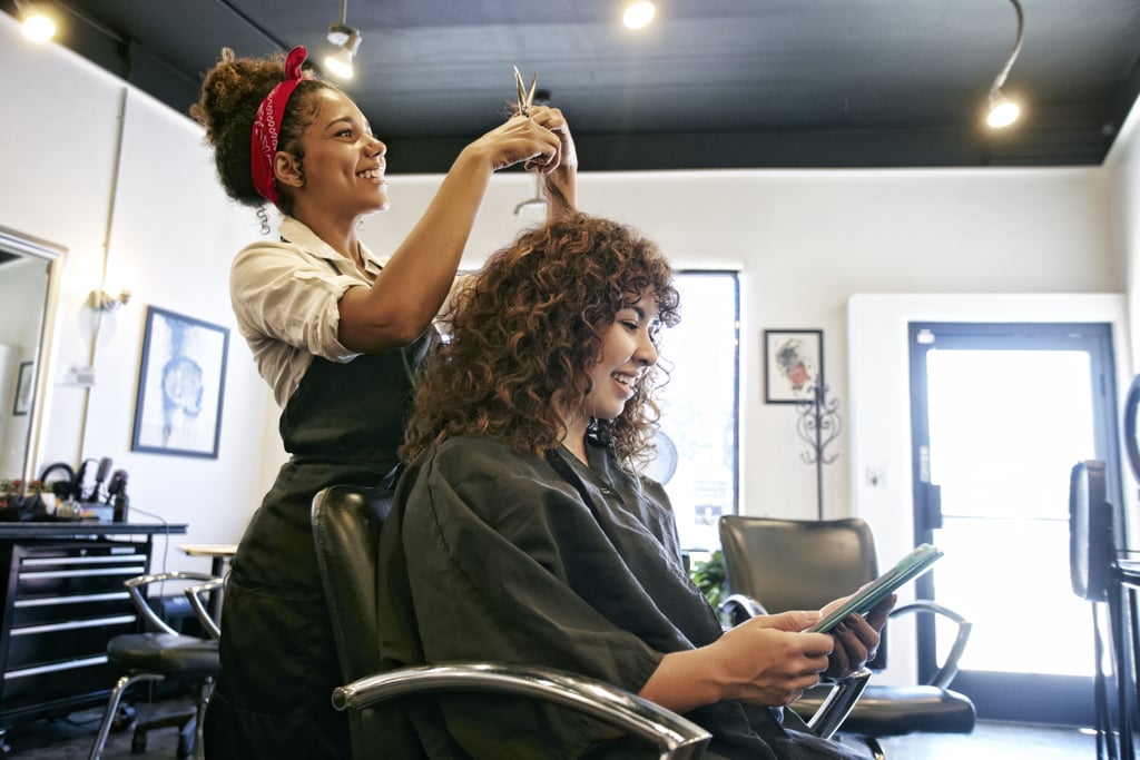 Dry Cuts on Curly, Textured Hair
Curly hair tends to lose its shape when wet, which is exactly why a dry cut is beneficial for this hair type. "With dry cutting, your stylist can enhance your curls and reduce bulk by cutting hair as each curl section falls," Conan says. "Instead of taking traditional sections like with wet cutting, your stylist will grab curl sections that live together and cut them as one piece." 
This reduces the chances of an uneven curl pattern if your hair dries unevenly. Conan also explained that this  technique helps the style hold its shape as it grows out and therefore, makes the haircut last longer. 
Dry Cuts on Thick Hair 
The number-one complaint that usually comes with thick hair is the weight; a dry cut can help address that. "Your stylist can remove interior bulk and create a reduced shape without needing to add a lot of visible layers," Conan says. "This can also be done wet, however, when done dry, it allows the sections to be softer and fall more strategically."