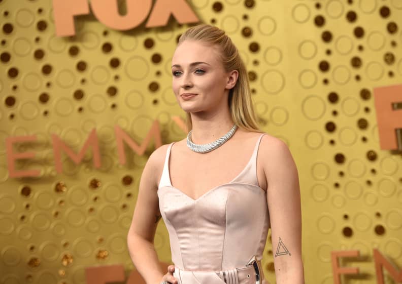 Sophie Turner Goes Solo to 2019 Emmys in Feminine Pink Gown While