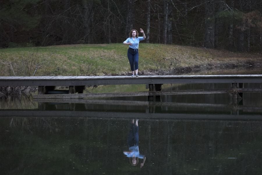 Here she is alone on a dock.