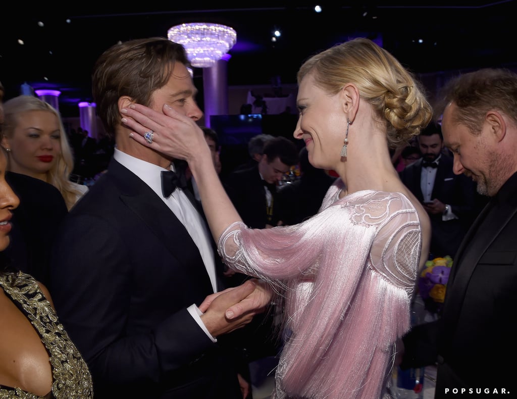 Cate Blanchett held Brad Pitt's face in her hands as they caught up after the show.