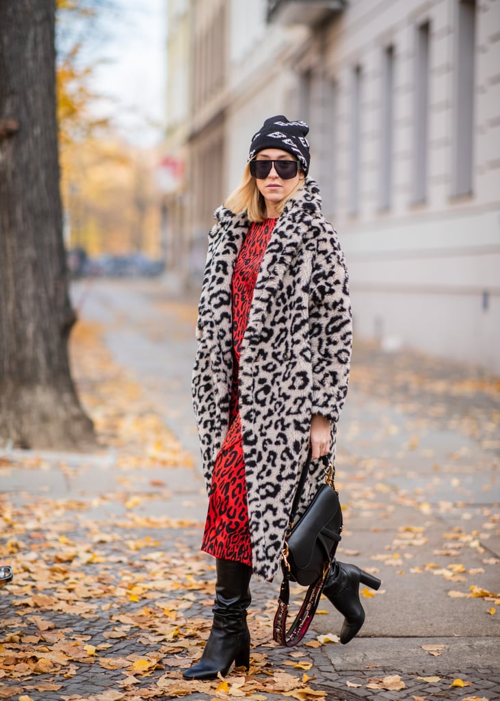 Wear an eye-catching, cherry red dress underneath a coat in a coordinating print, and leave the buttons undone.