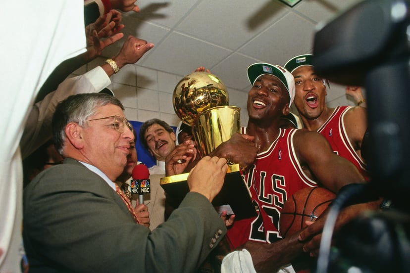 PHOENIX - JUNE 20: NBA Commissioner David Stern presents Michael Jordan and the Chicago Bulls the championship trophy after the Bulls defeated the Phoenix Suns in Game Six of the 1993 NBA Finals on June 20, 1993 at America West Arena in Phoenix, Arizona. 