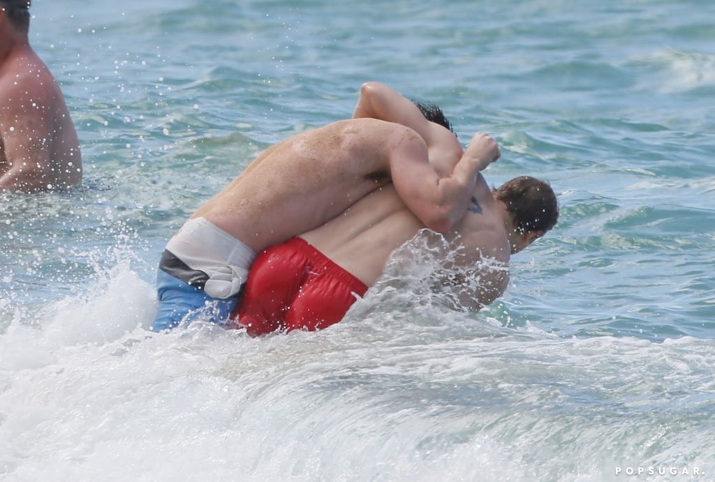 Charlie Hunnam and Garrett Hedlund Wrestle in Hawaii Photos