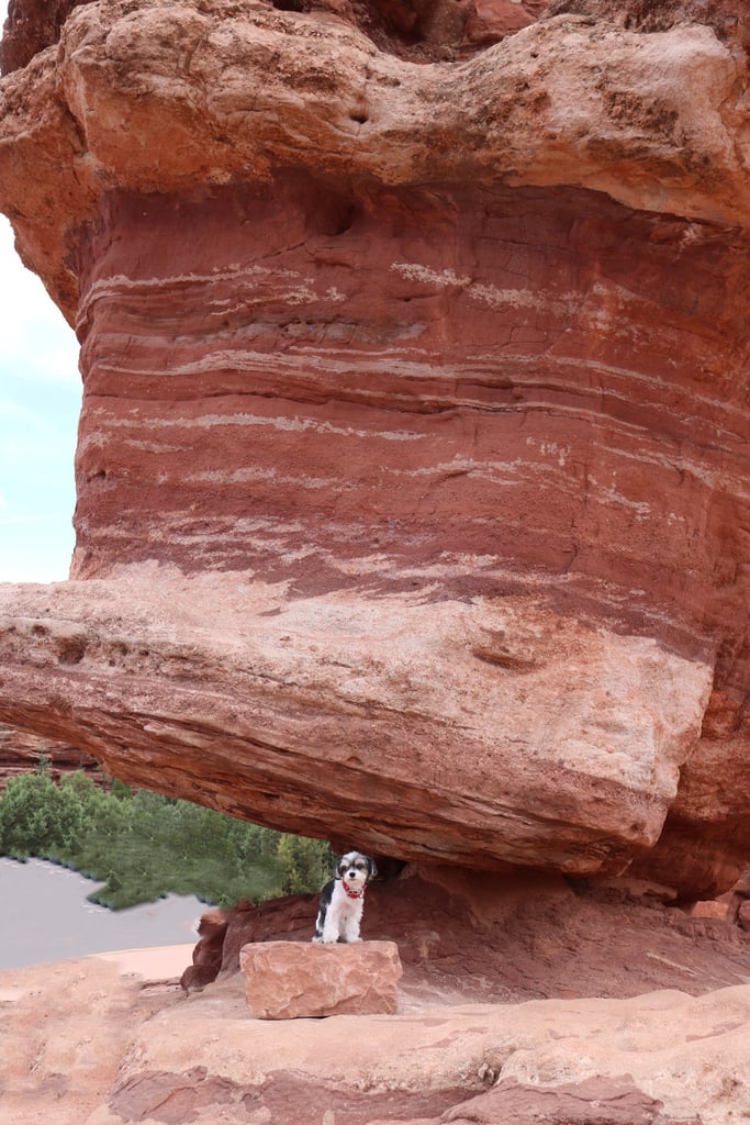 Balancing with the famous balancing rock at Garden of the Gods!