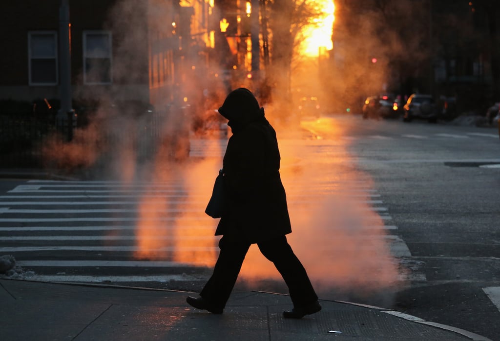 A lone pedestrian hit the streets in NYC, where temperatures hit a record low of 4 degrees.