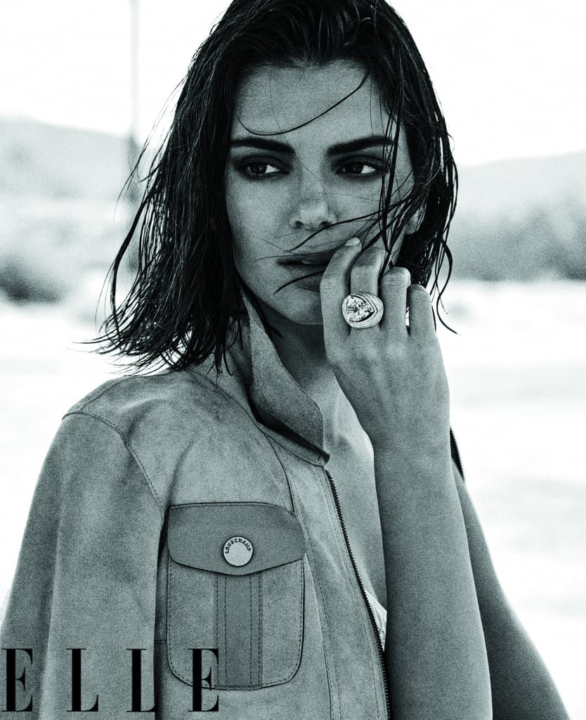 Kendall is wearing a Longchamp jacket over an Araks bralette with Cartier jewels.