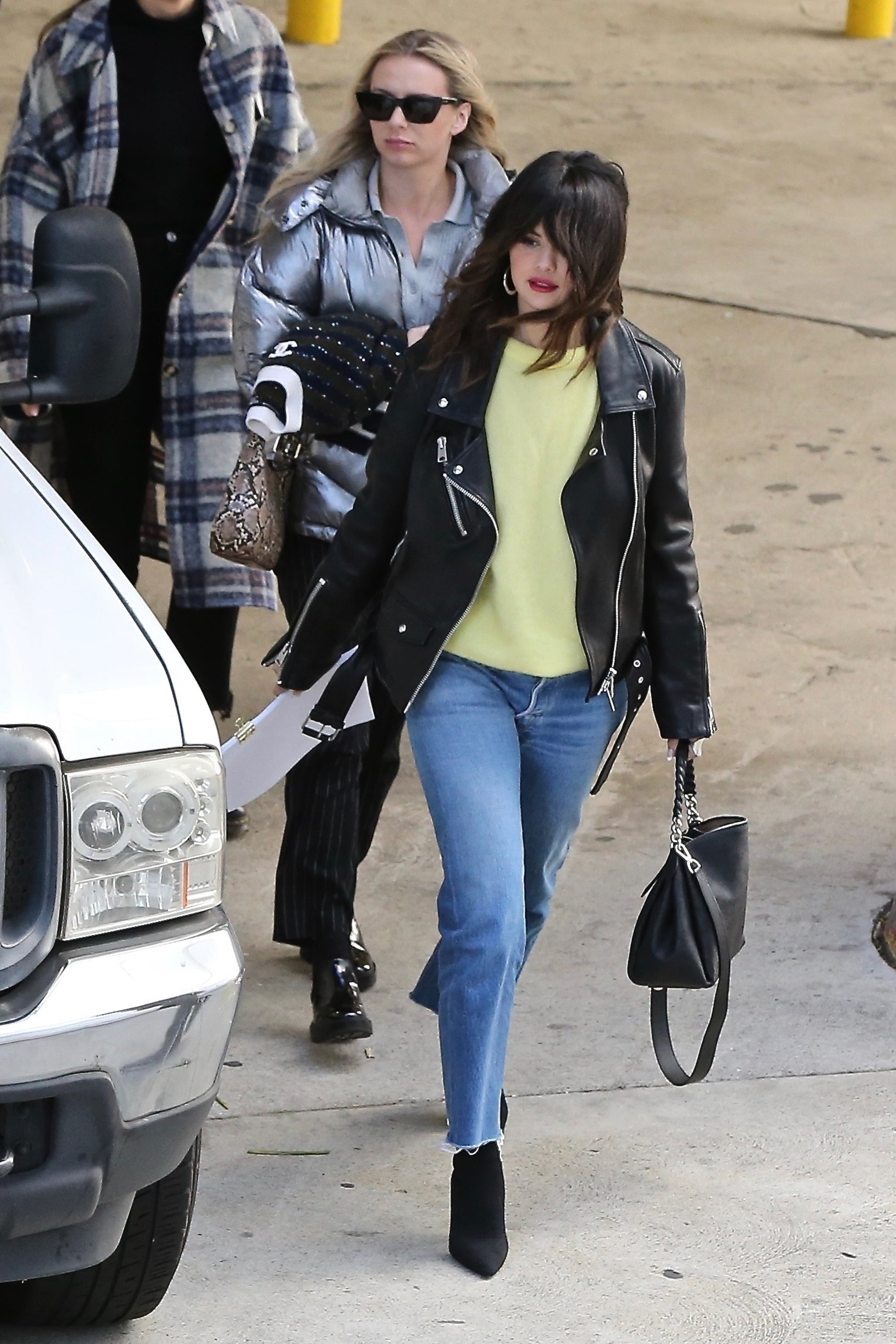 Selena Gomez Wearing Leather Jacket And Yellow Sweater Popsugar Fashion Uk