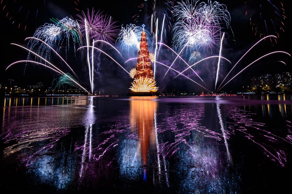 Fireworks lit the sky behind Brazil's record-breaking floating Christmas tree — the world's highest at 85 meters tall.