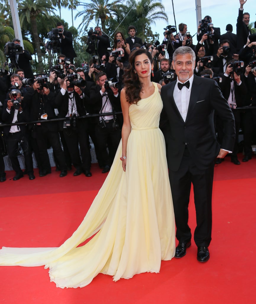 George and Amal attended the premiere of Money Monster at the 2016 Cannes Film Festival. She wore a yellow Atelier Versace gown that gave off modern Belle vibes.