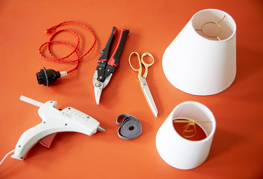 Here's What You’ll Need:

Wire snippers
Scissors
Glue gun and glue sticks
Ribbon
Pendant kit (mine had a 4-foot cord)
A large white paper coolie shade with European hardware (4" x 8" x 6.6")
A small white paper coolie shade with clip hardware (3.5" x 5" x 5")
3 cup hooks (not pictured)