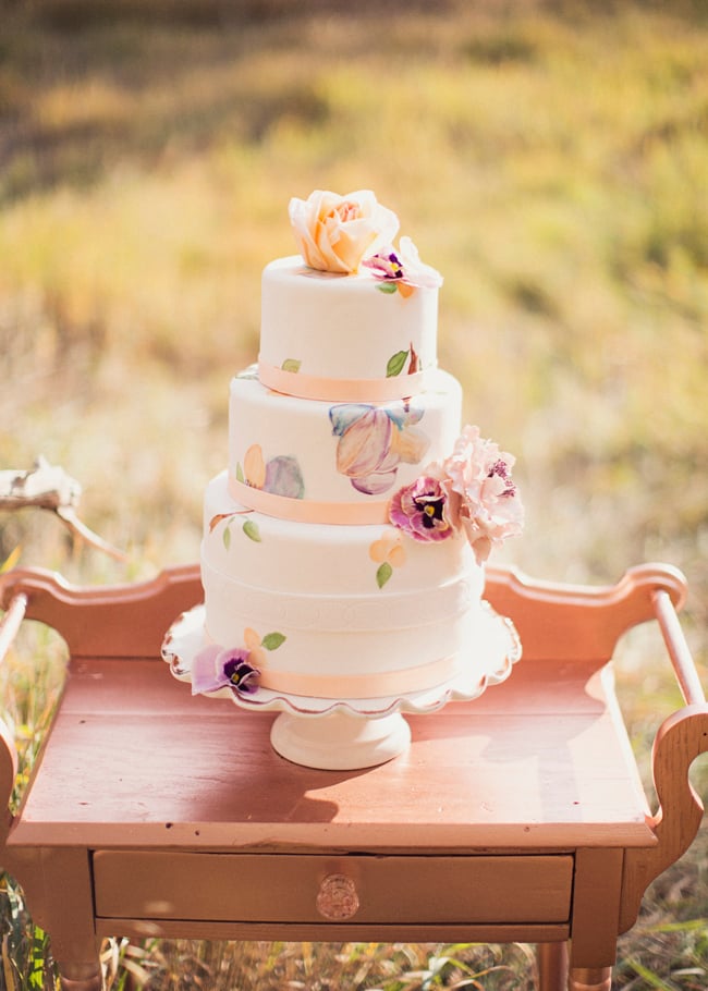 Pastel colors automatically make a cake feel girlie; top that with hand-painted details, and you've got one charming dessert.