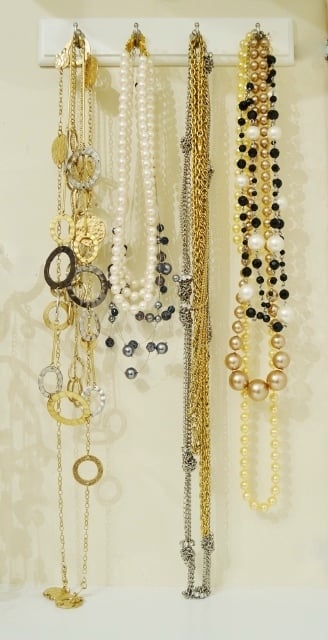 By hanging a key rack on the shelf wall, I was able to acquire some much-needed extra storage. Key racks are a great way to utilize the vertical space that's often available yet often forgotten.