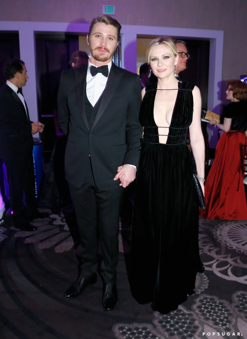 Garrett Hedlund and Kirsten Dunst held hands.