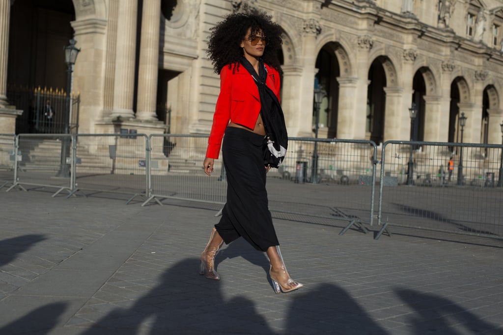 Styled with a red blazer and baggy cargo pants.