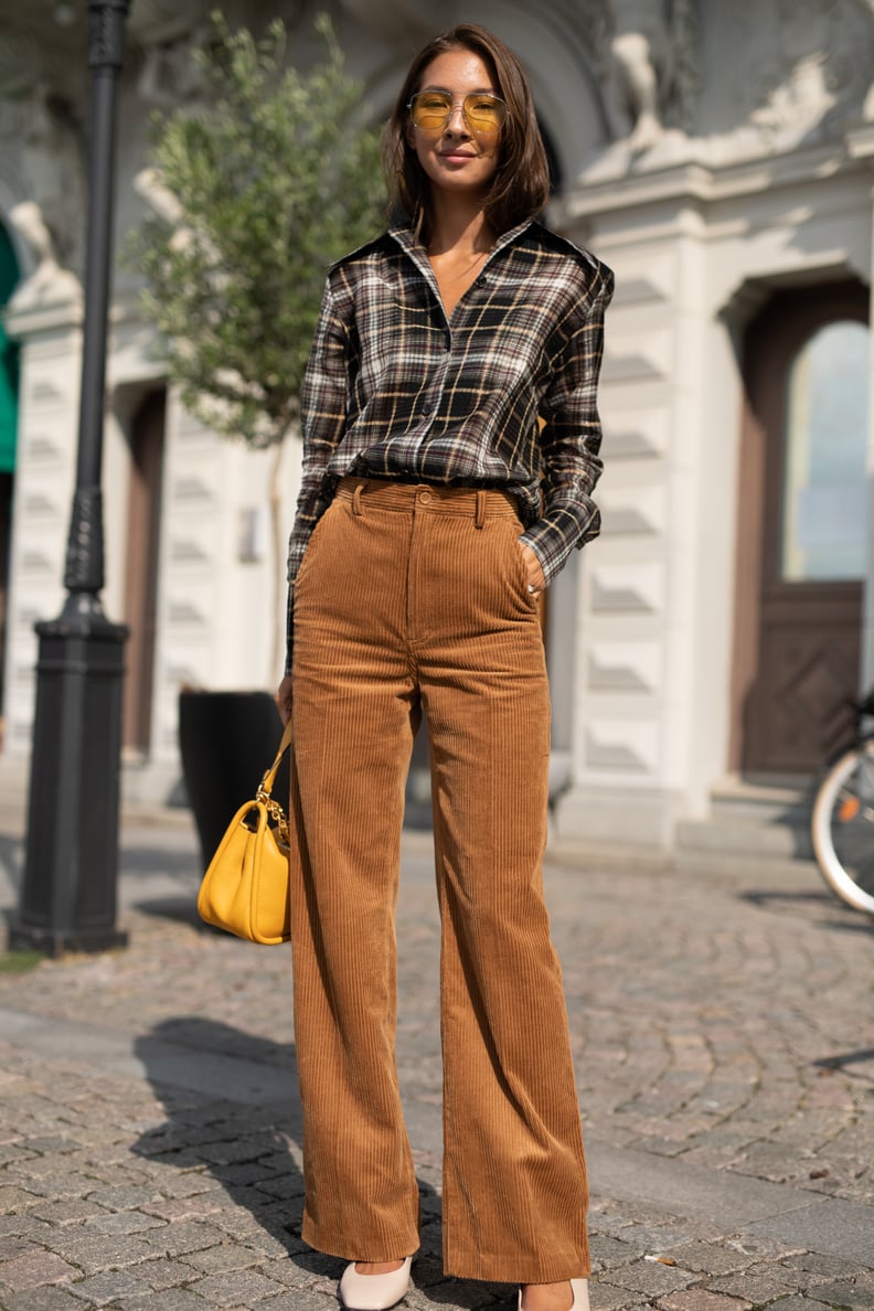 Keep things classic in a plaid button-down and trousers.