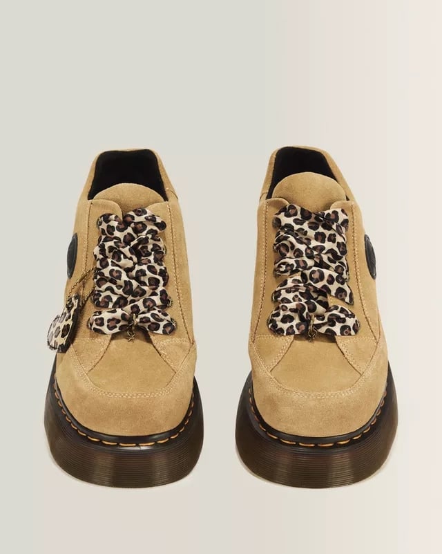 Dr. Martens Buzz 5 Eye Bronx Suede Shoes ($140)
In an arena full of monochromatic outfits, have a little fun with your footwear. I love that these neutral shoes have a pop of cheetah print thanks to the fun laces. You can trust that the heavy sole will keep your feet supported through a full night of dancing. Alternatively, you can level up the look even more with a pair of platform boots to really lean into the combat style.