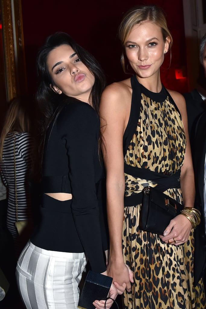 Kendall Jenner gave her best duck-face pose while holding hands with pal Karlie Kloss at the Balmain afterparty during Paris Fashion Week on Thursday.