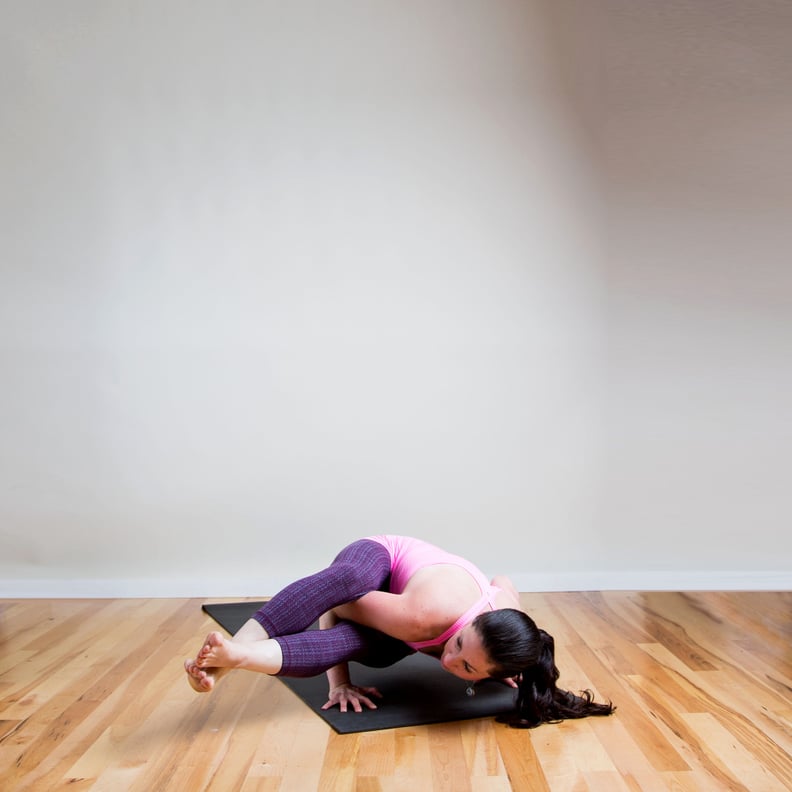 difficult advanced yoga pose by attractive female, on white