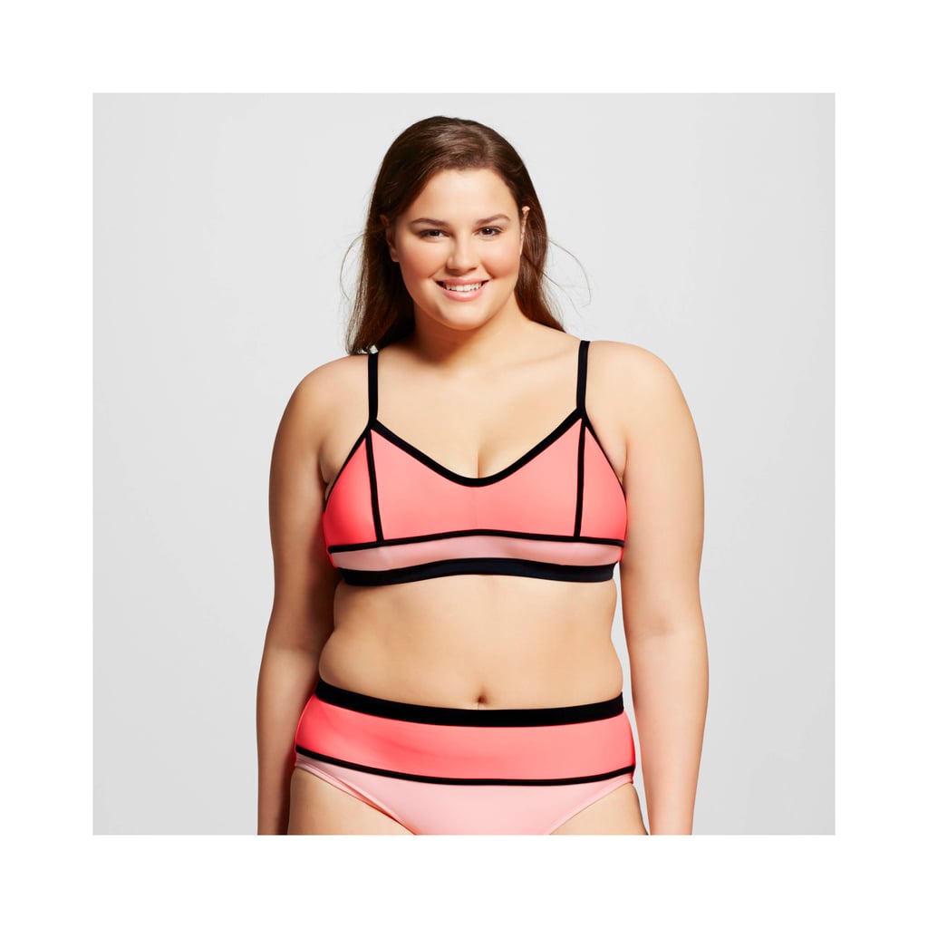 Trying out bold stripes and colorblocking has never looked better — and we all know coral looks gorgeous on the beach. So give this Target triangle bikini top ($20) a try.