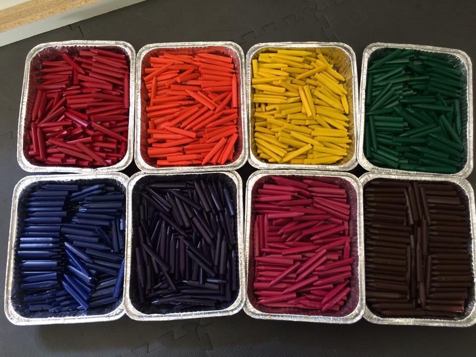 The new crayons are laid out to be boxed up.