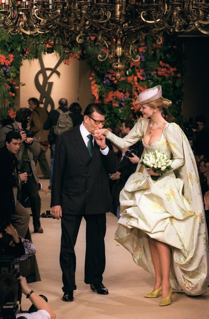 A kiss for Claudia Schiffer at the end of the catwalk after his Spring/Summer '97 haute couture presentation.
A kiss for Claudia Schiffer at the end of the catwalk after his Spring/Summer '97 haute couture presentation.