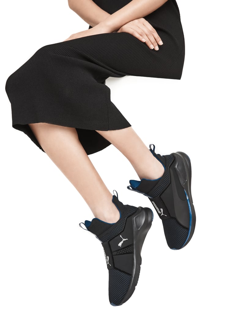 A pair of slip-on sneakers ties the functional look together.