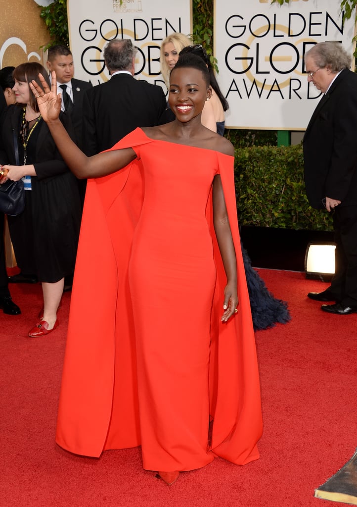 Lupita Nyong'o was gorgeous in red as she waved to the crowds outside.