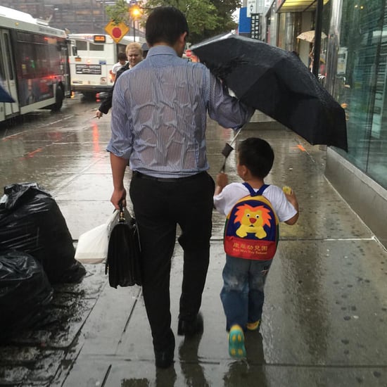 "Umbrella Dad" Shields Son From Rain