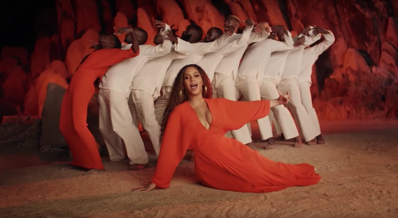 Bey's Bright Orange Pleated Gown
