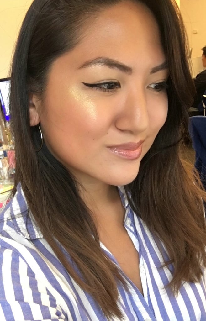 Who: Kristina Rodulfo, editor, Beauty
Complexion: Tan
Review: "This is Rihanna we're talking about, so I didn't expect anything but some over-the-top glow from her highlighters. This yellow-gold one is a tad much for everyday wear, but come holiday season, you bet I'll be applying this not just atop my cheek and brow bones but alllll over. One tip: build up the color gradually. I packed on the powder too much and my first stroke was nearly blinding. It took a fair amount of blending to get to what you see in the photo, but I love the end result and how it complements my skin tone."