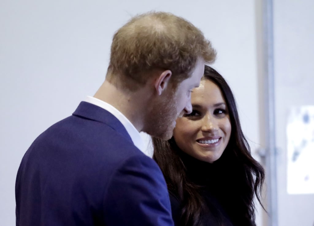 Meghan Markle Looking at Prince Harry Pictures