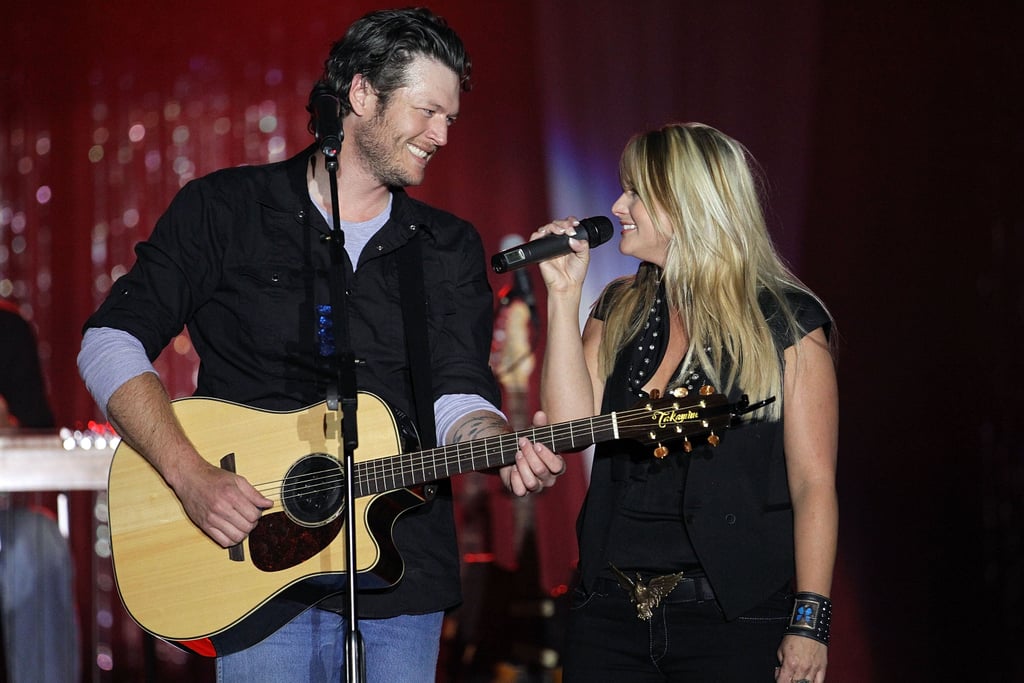 May 2010: Blake proposed to Miranda on May 9, 2010, after asking her father for his blessing. "I fumbled it up a little," Blake told Us Weekly about his proposal. "It's funny how you rehearse those things and go over what you want to say, but I probably screwed it up." Miranda described the excitement of being engaged to Blake to People at the time, saying, "Weddings are great and engagements are great, and diamonds are especially great, but I'm just excited to be married because I want to tell Blake I really can love him the rest of my life and be happy and make him happy."
May 2011: A year after getting engaged, the country cuties tied the knot in Boerne, TX. According to Us Weekly, Ashley Monroe sang "Makin' Plans" as Miranda walked down the aisle, and Blake later performed "Let's Grow Old Together" for his bride.
July 2011: After saying "I do" earlier that Spring, the "Honey Bee" singer released his sixth studio album, Red River Blue, in July. The album featured his new wife on the title track and gave Blake four No. 1 singles.
November 2011: Miranda followed in her husband's footsteps in 2011 by releasing her own album, Four the Record, in the Fall. The song "Over You" was another cowrite credited to Miranda and Blake and led to two major award wins for Miranda.
2011: Blake became a coach on The Voice, which brought his life to Los Angeles in addition to spending time touring and being back home in Oklahoma with Miranda. Throughout his time on the NBC series, Miranda made time to appear as his team's mentor and give performances on the show.