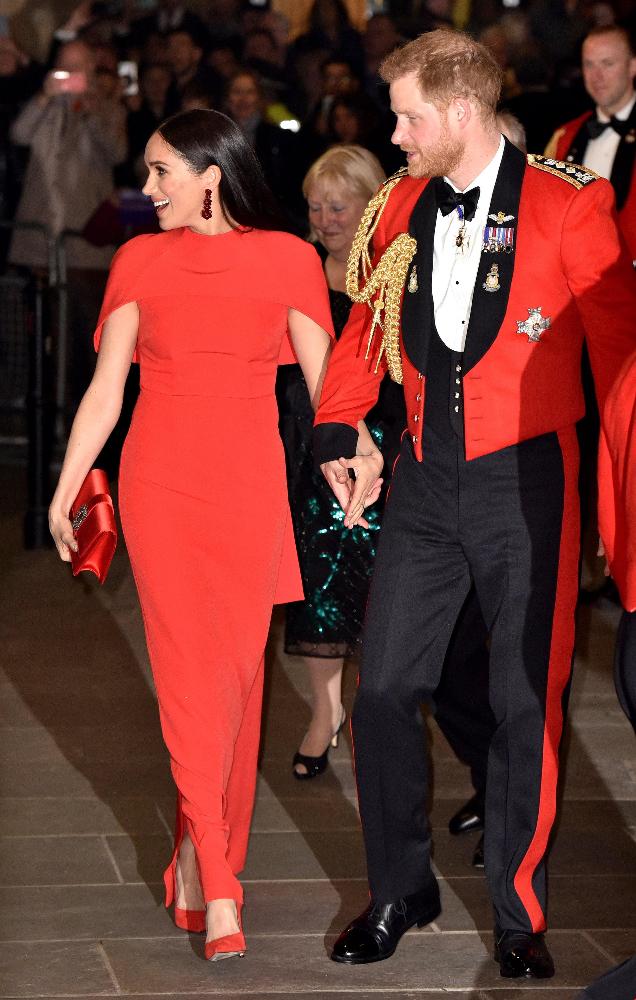 Meghan Markle At The Mountbatten Festival Of Music Meghan Markle Color Coordinates With Prince Harry In A Red Safiyaa Cape Dress Popsugar Fashion Photo 28
