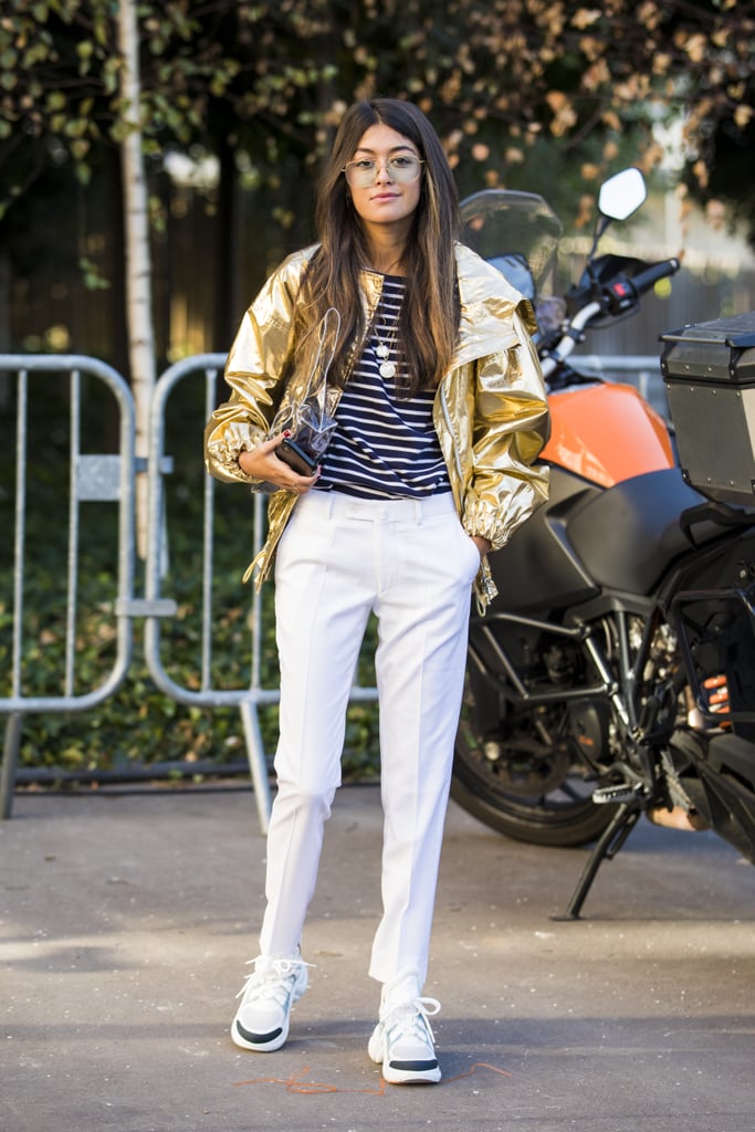 A metallic jacket is unexpected with a nautical stripe and white pants.