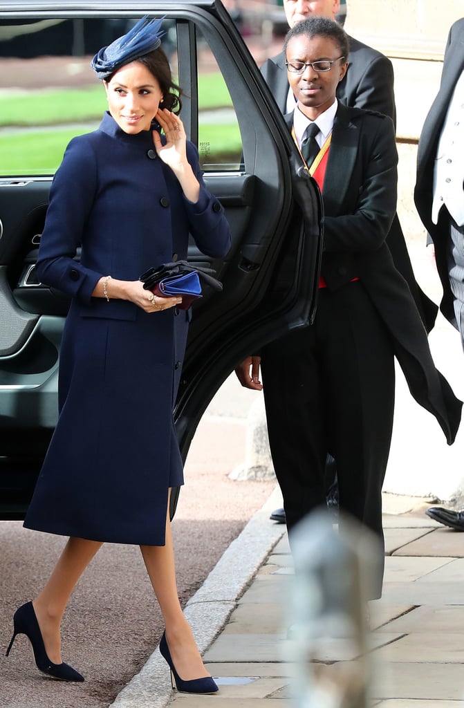 The Duchess of Sussex looked elegant at Princess Eugenie's October 2018 wedding wearing a Givenchy dress with a navy coat and her trusty Manolo Blahnik heels. She accessorised the look with a bespoke hat by Noel Stewart.