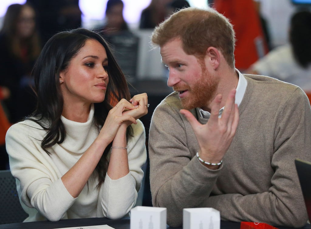 Meghan Markle Looking at Prince Harry Pictures