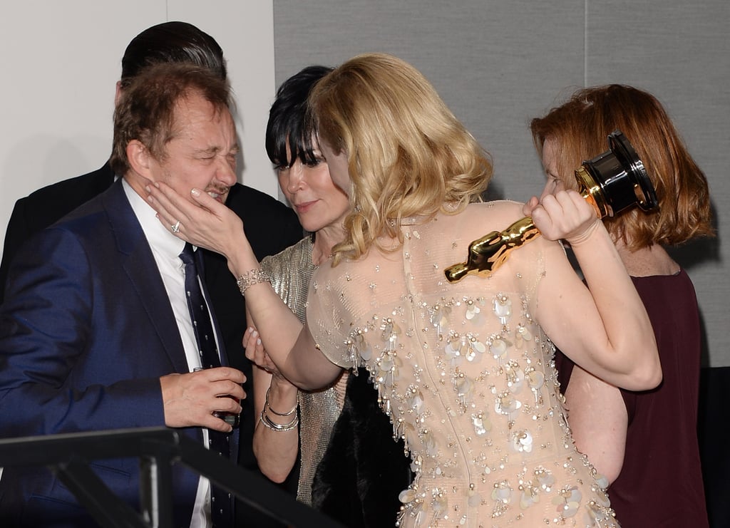 Blanchett stroked her husband Andrew Upton's cheek.