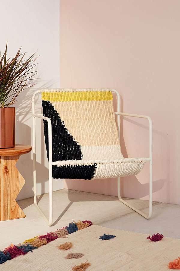 The hint of yellow on this Urban Outfitters Kimball Colorblock Macrame Sling Chair ($329) will add cheer to your home.