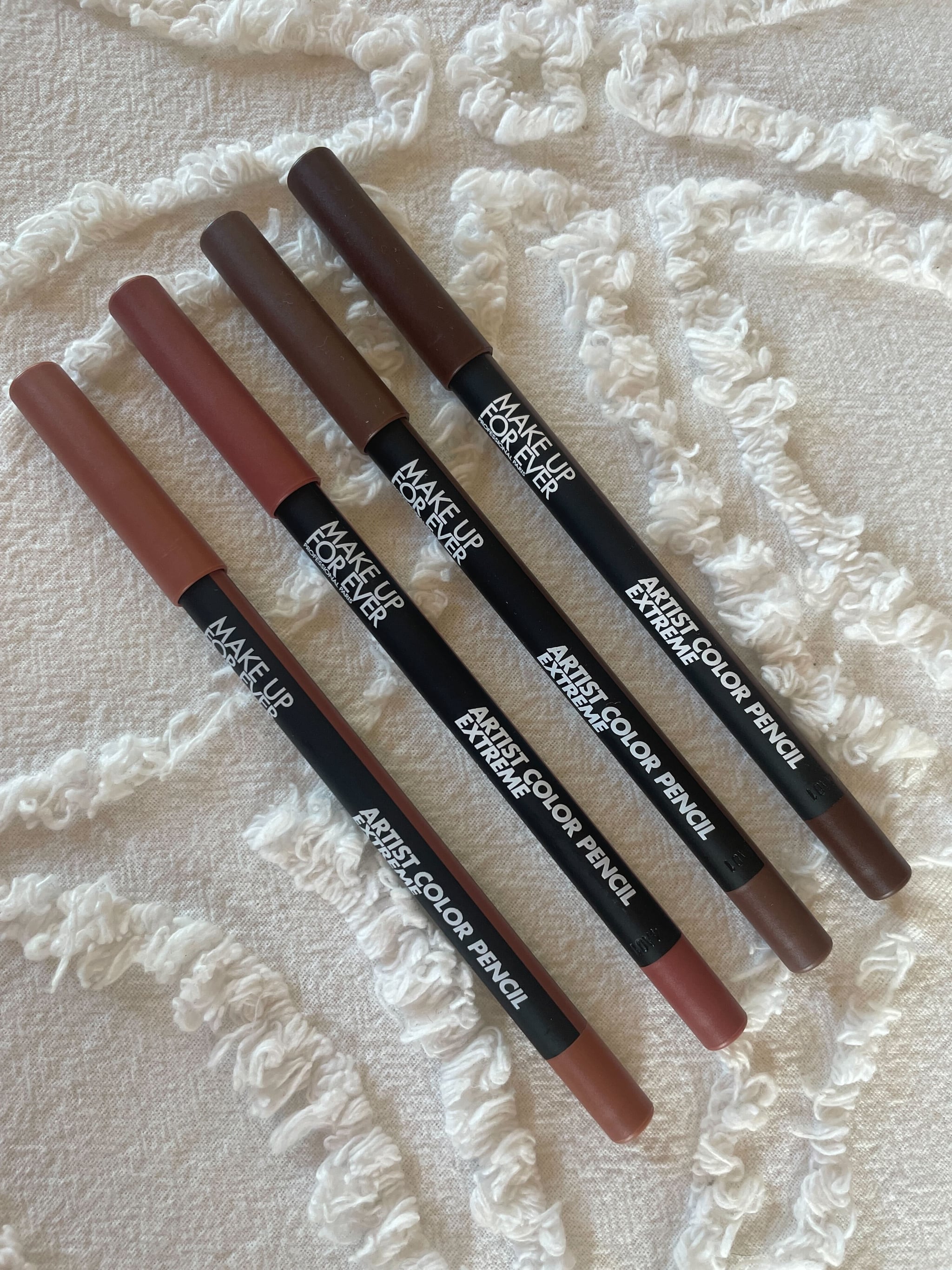 Flat Lay of Four Different Nude Artist Color Pencil Extreme Shades